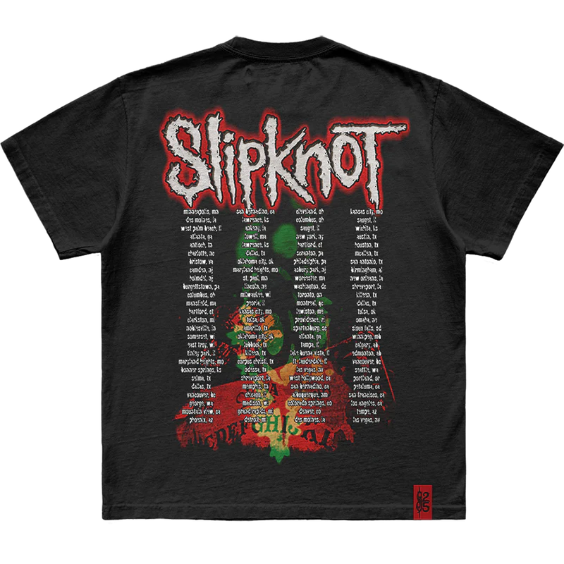 Unleash your bold side with the 'Electric Chair Splatter' Slipknot t-shirt. This black tee features an eye-catching splatter graphic inspired by the electric chair theme on the front and the iconic 25th anniversary tribal S logo on the back. A perfect choice for fans who want to showcase their intense passion for Slipknot. Get yours now!