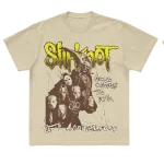 Tan t-shirt featuring a mask goat silhouette graphic with "Here Comes the Pain 25th Anniversary" on front and a goat silhouette on back